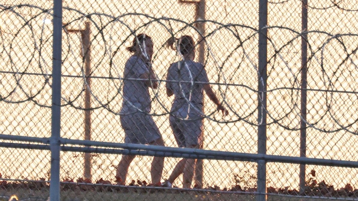 Ghislaine Maxwell walks outside Florida prison with a buddy
