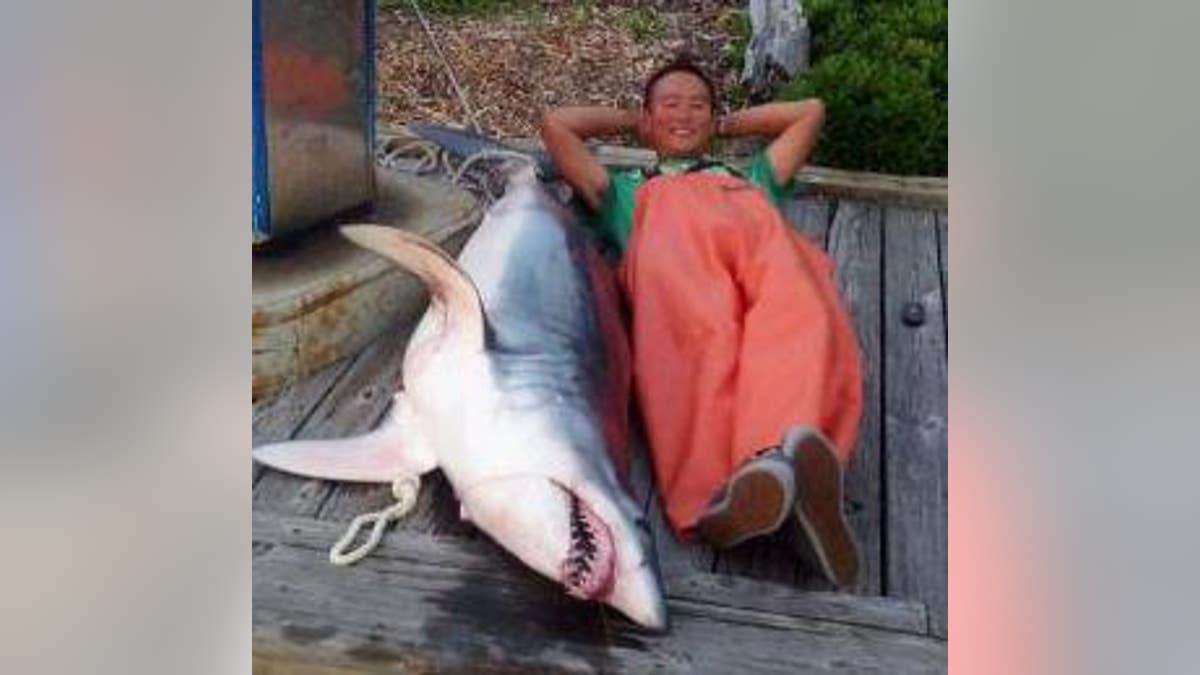 Dr. Marvin Moy poses alongside a big catch