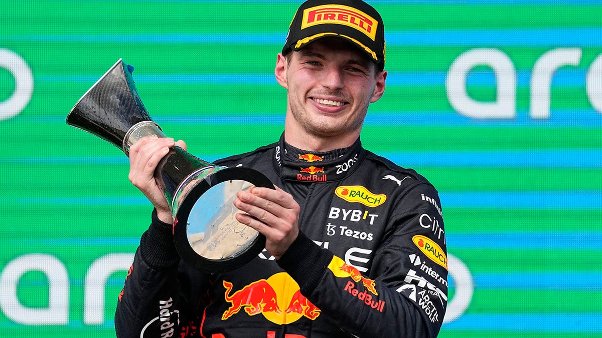 Max Verstappen holds the trophy