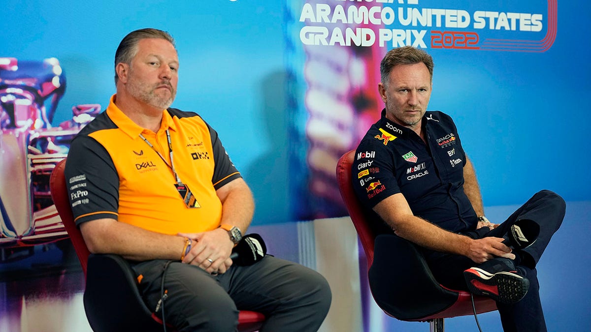 McLaren and Red Bull representatives at a news conference