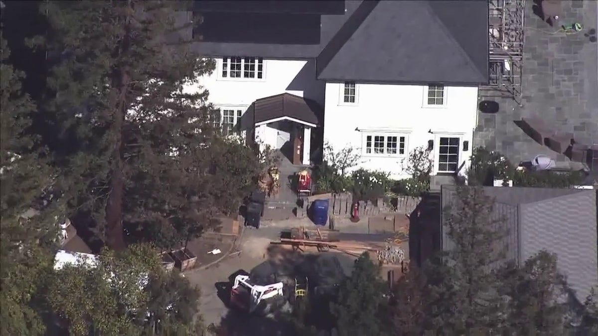 Police search California mansion where car was found buried
