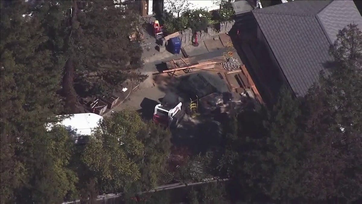 Police search California mansion where car was found buried