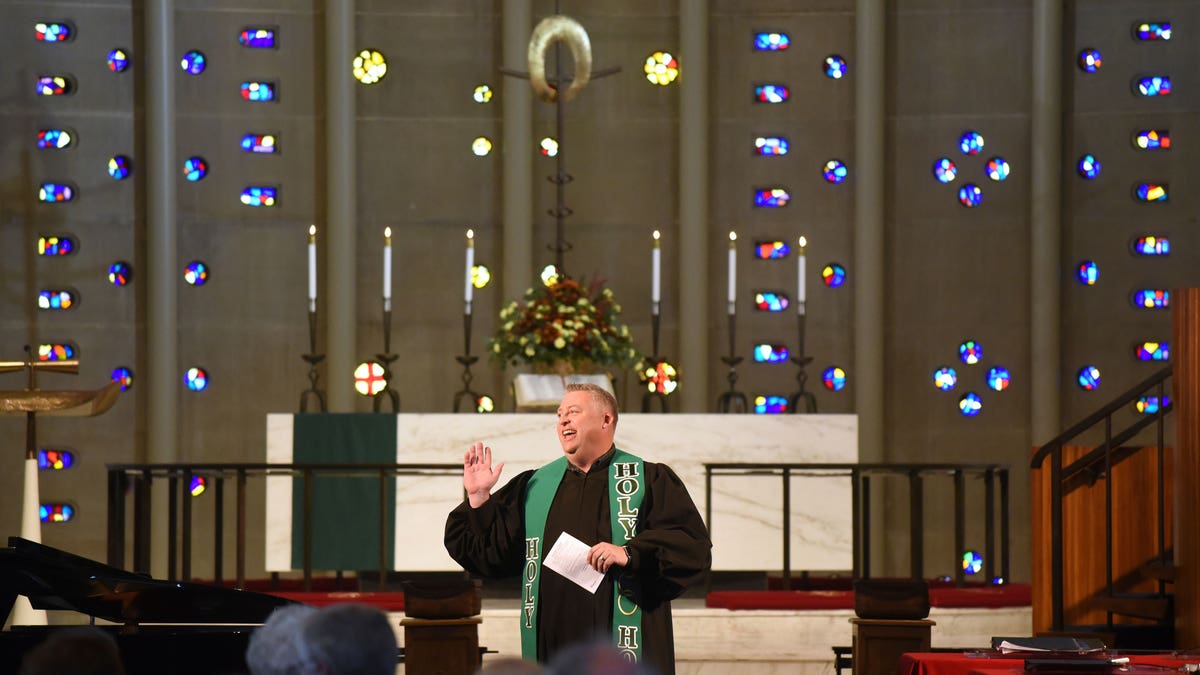 Priest preaching at the alter