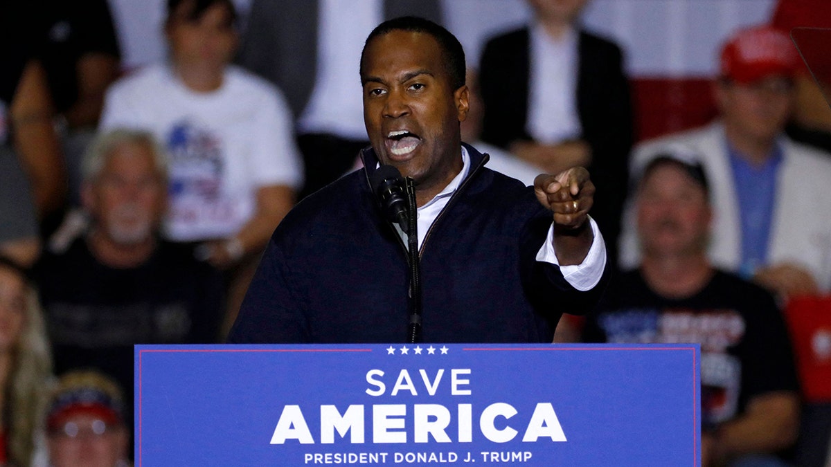 Republican Michigan U.S. House Candidate John James speaks at a rally with former President Donald Trump