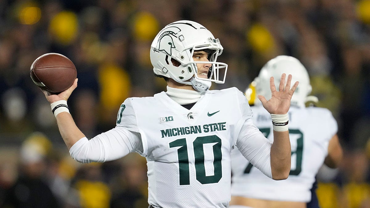 Michigan State quarterback throws a pass