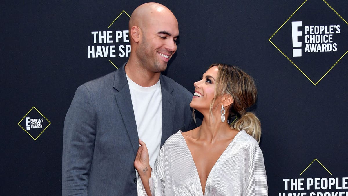 Mike Caussin and Jana Kramer on the red carpet