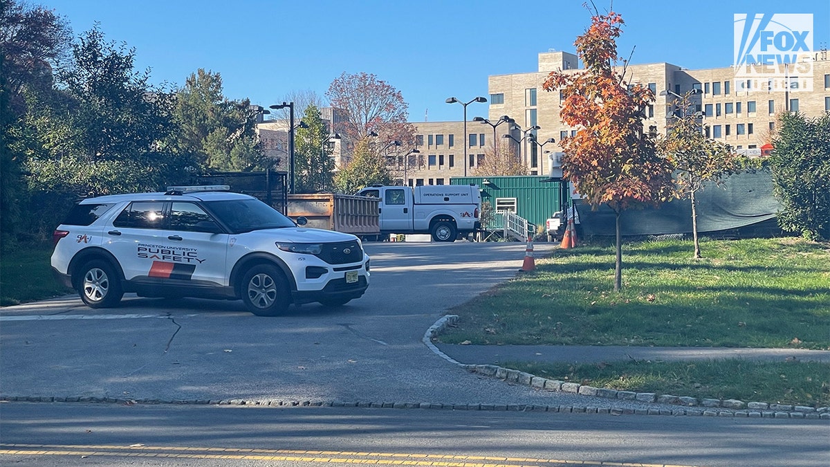 Police and Department of Public Safety vehicles outside a Princeton building