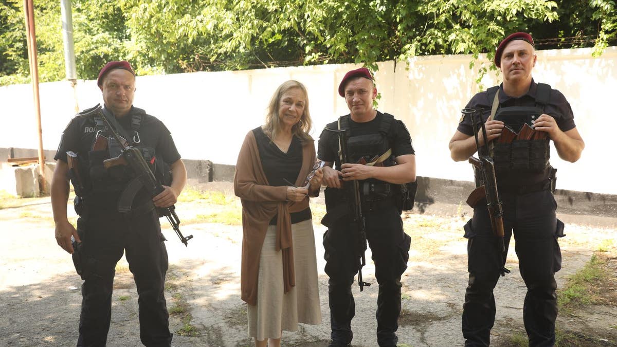 Mitzi Perdue with her team of body guards in Ukraine. 