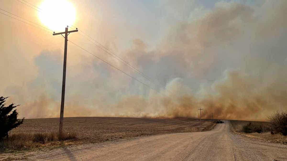 NE smoke rises from a grass fire