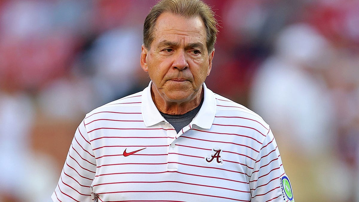 Nick Saban looks on field