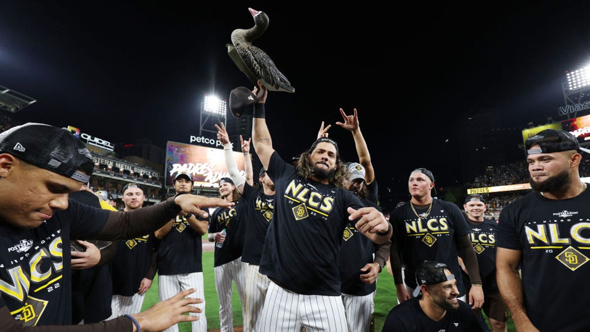 San Diego Padres players celebrates with a plastic goose