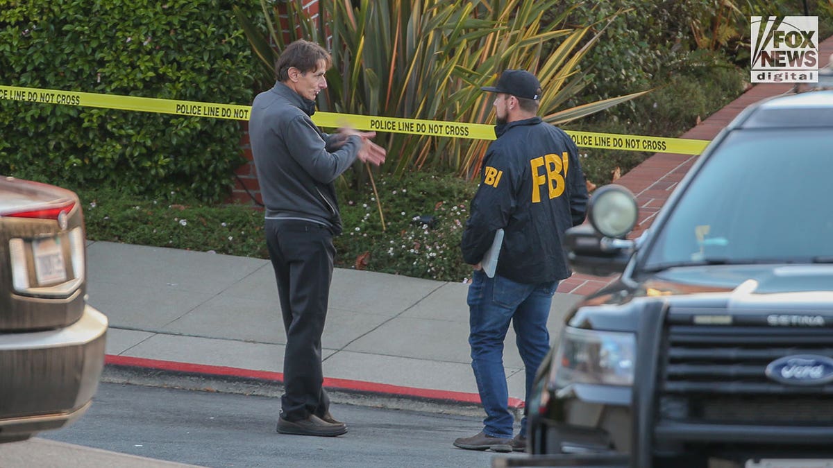 Paul Pelosi Jr. talking with FBI agent