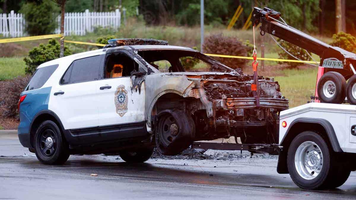 A burned out police vehicle