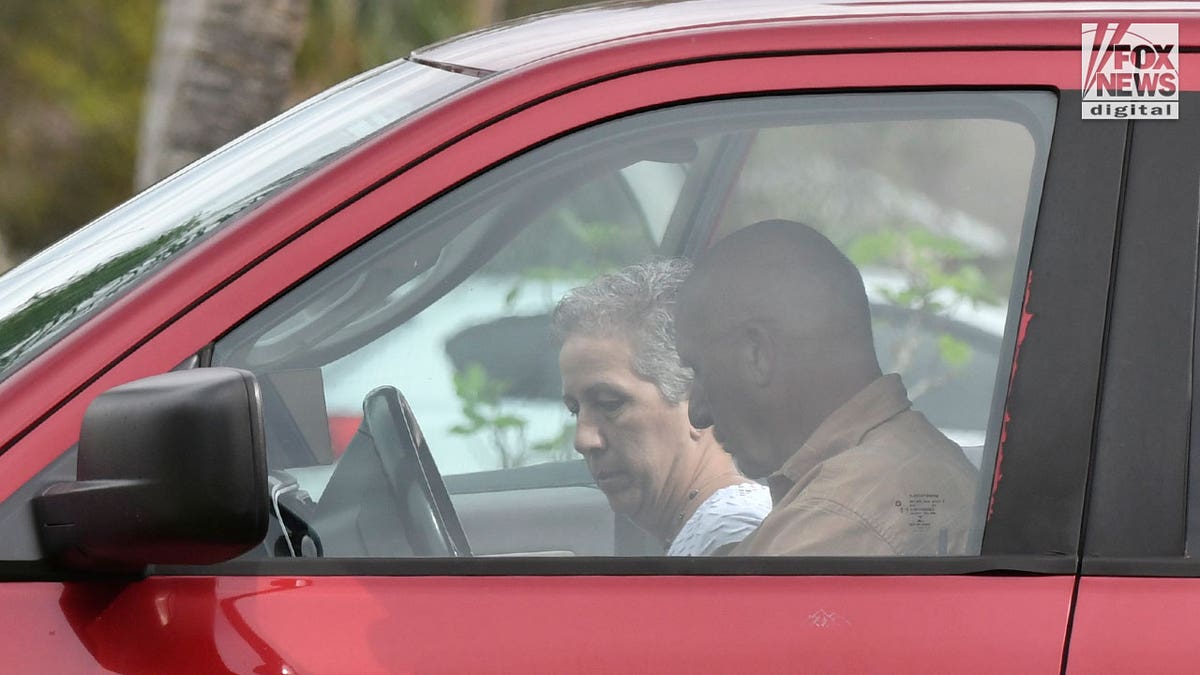 Brian Laundrie's parents, Chris and Roberta Laundrie are seen outside their home