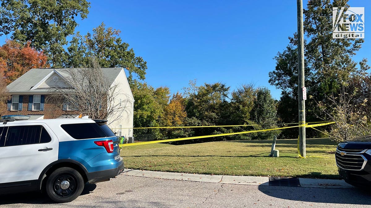 raleigh north carolina police car parked in front of crime scene tape