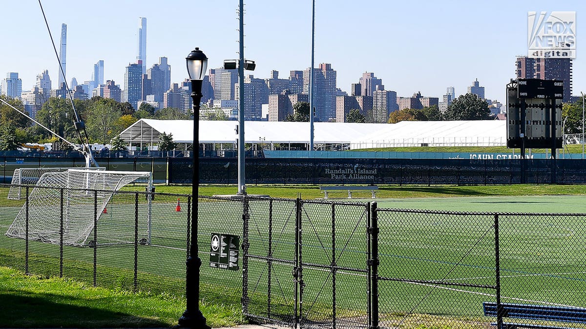 randall's island shelter behind fence