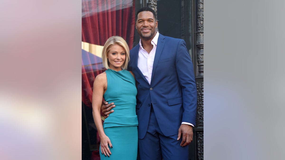 Michael Strahan and Kelly Ripa smile in Hollywood