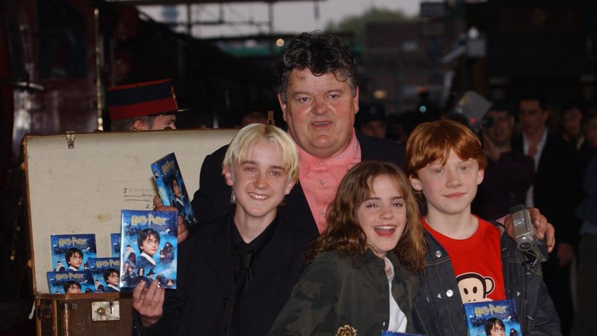 Robbie Coltrane with the cast of "Harry Potter"