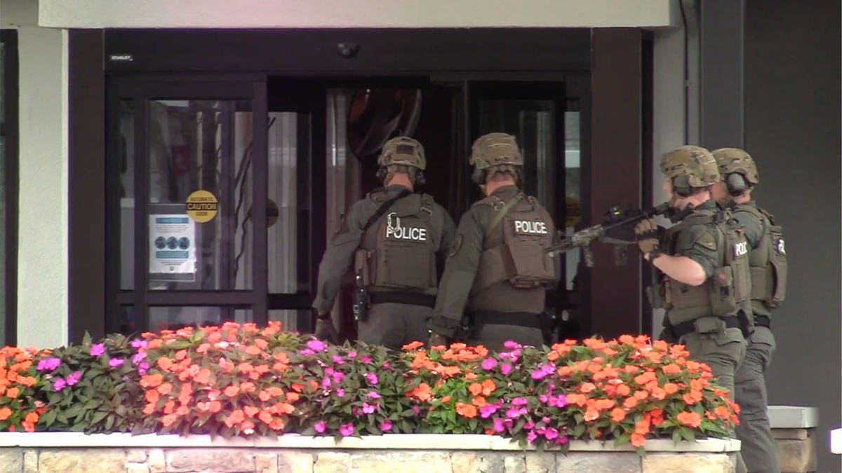 officers police outside marist college hotel