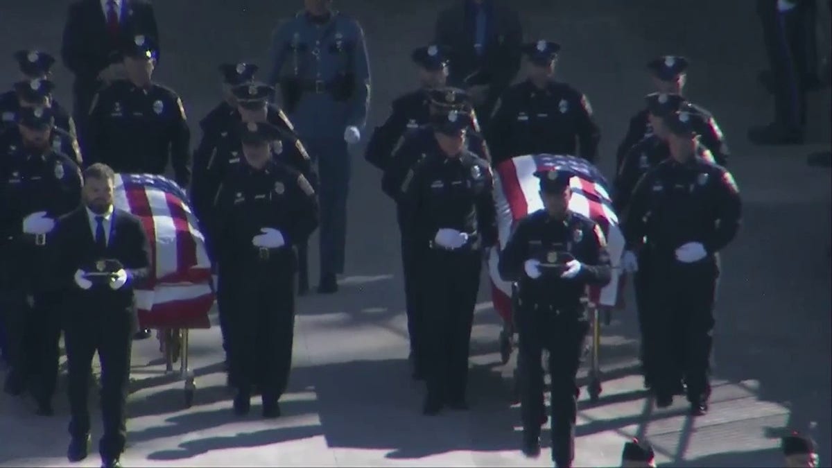 Bristol, Connecticut police officers' caskets enter joint funeral
