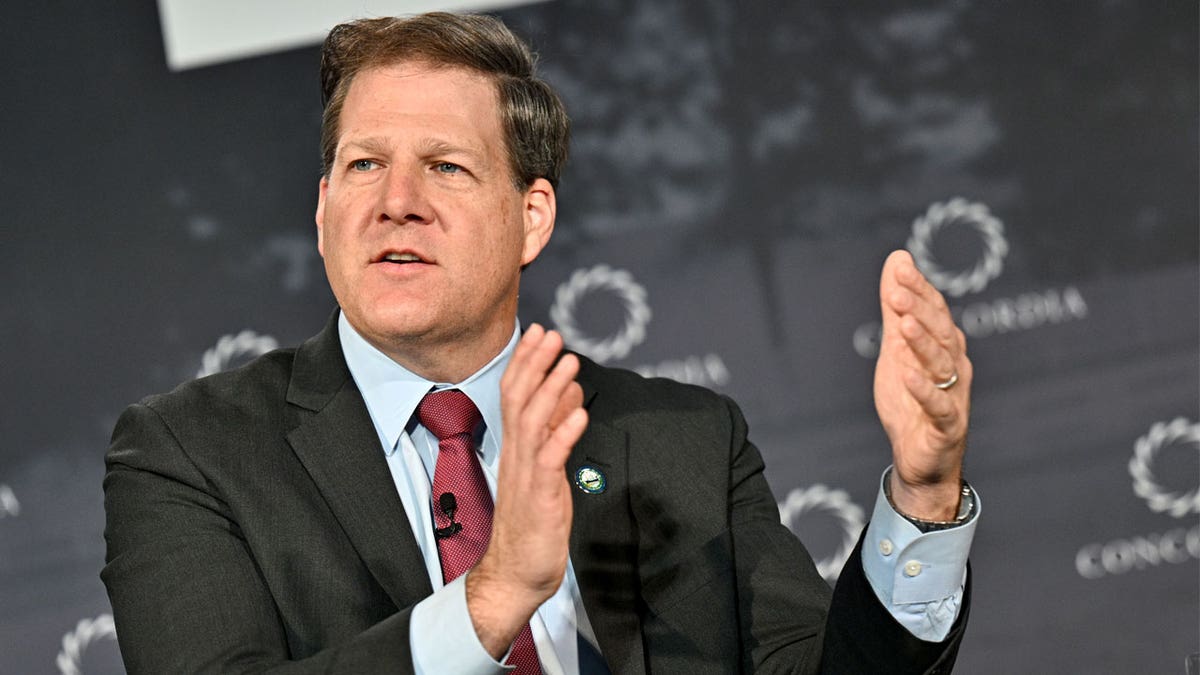 Chris Sununu raising arms