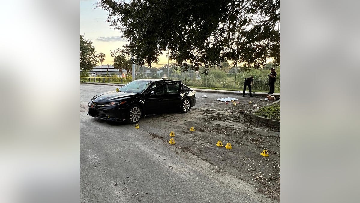 Casings on ground outside car