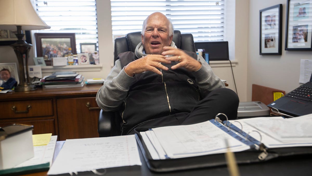 Tom Brady Sr. at his desk