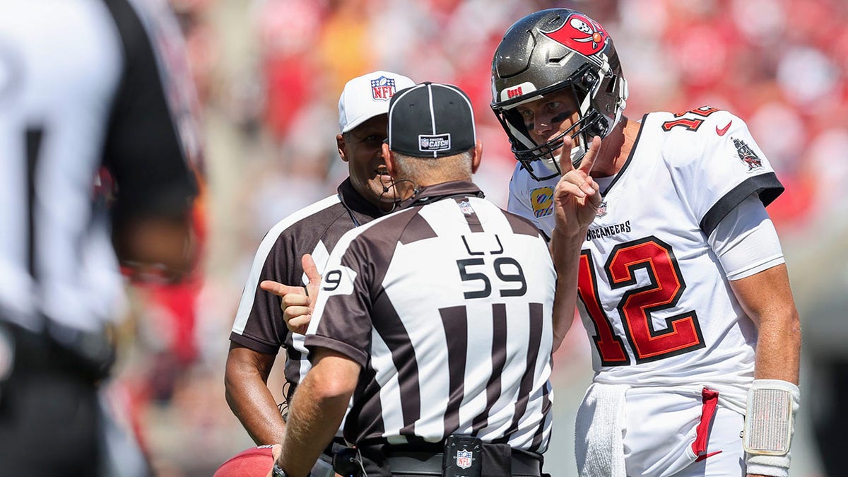 Tom Brady talks to the refs