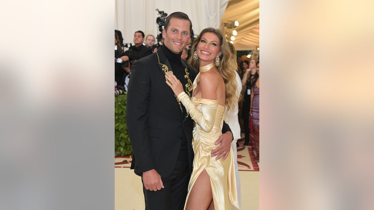 Tom Brady and Gisele Bundchen wears matching gold outfits to Met Gala in New York City in 2018