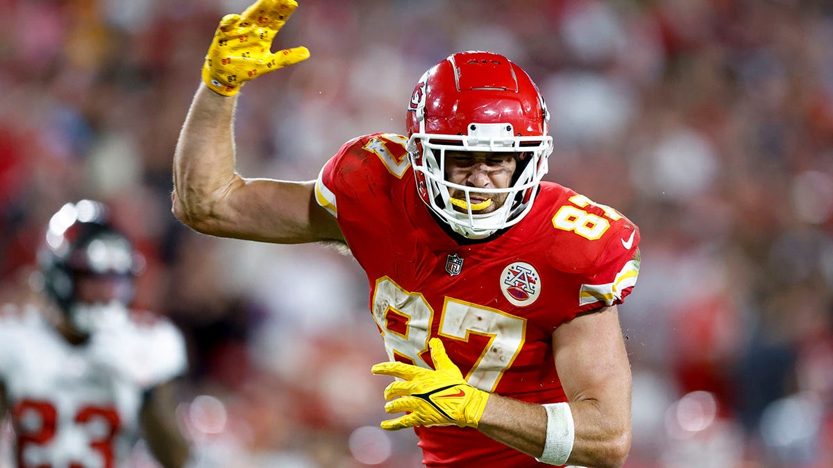 Travis Kelce reacts to a first down