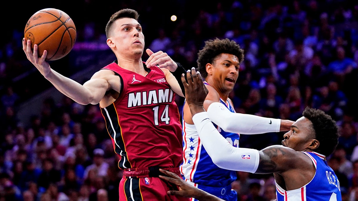 Tyler Herro goes up for a shot