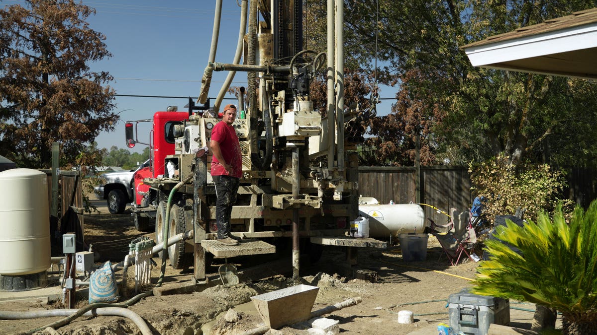 Man operating a well-drilling rig