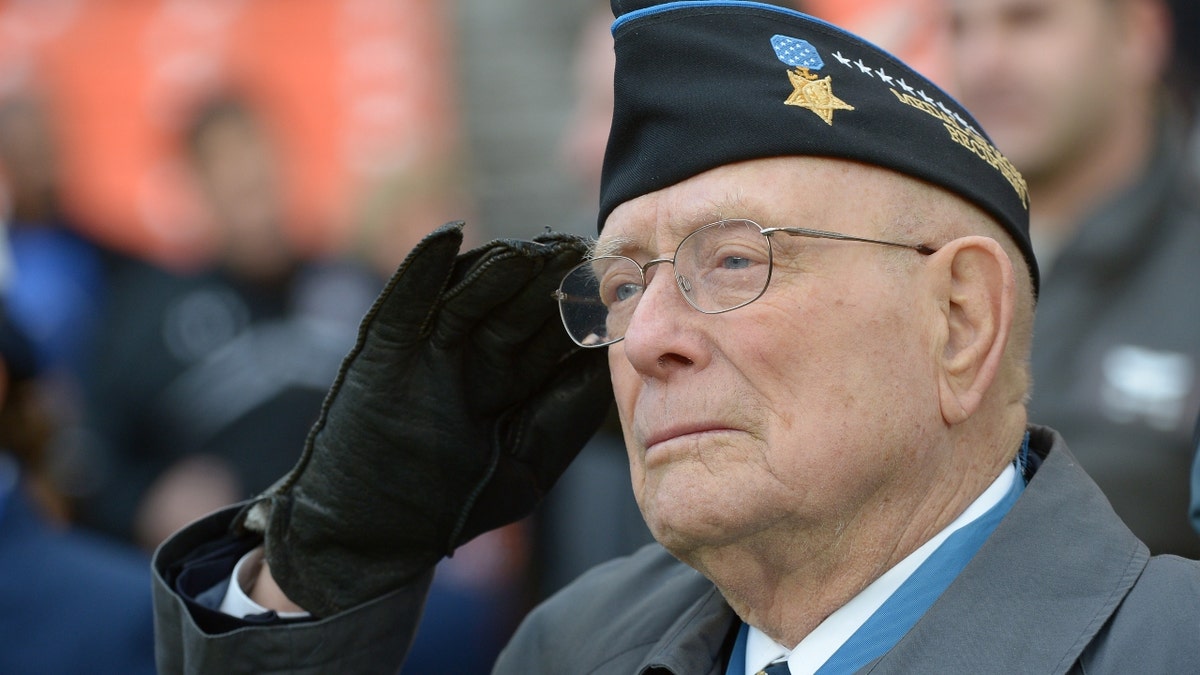 Woody Williams saluting during National Anthem.