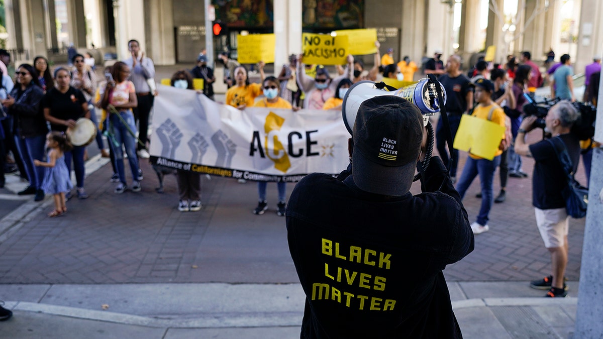 LA city hall protester with Black Lives Matter shirt