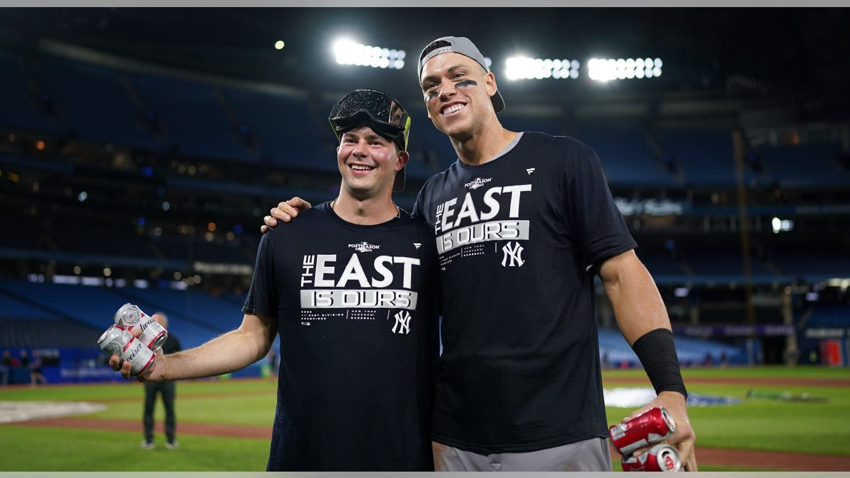 Scott Effross and Aaron Judge celebrate