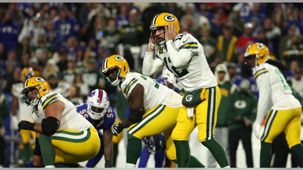 Aaron Rodgers of the Green Bay Packers prepares to take a snap during the third quarter against the Buffalo Bills at Highmark Stadium on Oct. 30, 2022, in Orchard Park, New York.