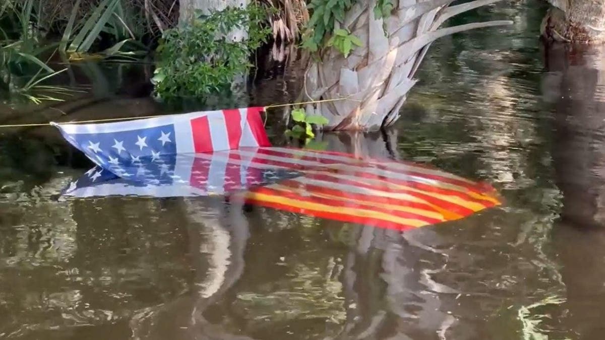 American flag in the water