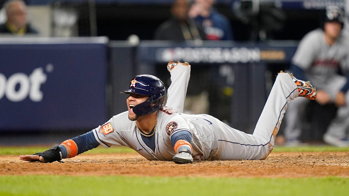 Yuli Gurriel slides into home