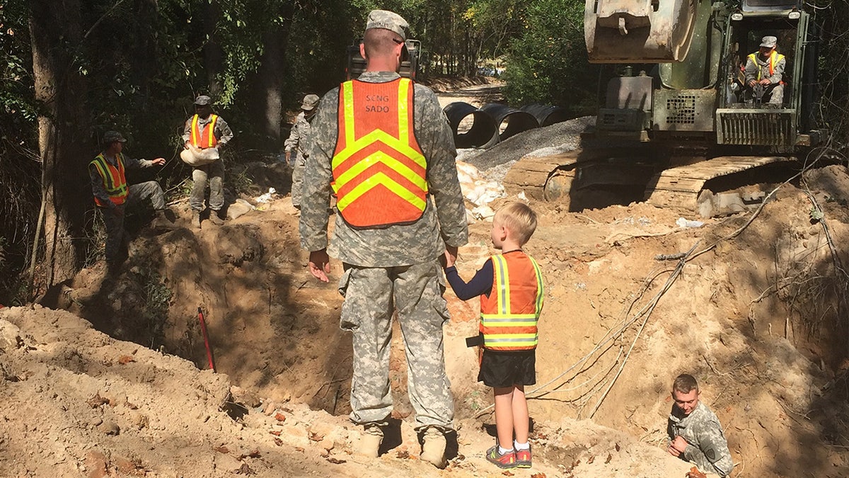 Benjamin Sternemann and son visit National Guard work site