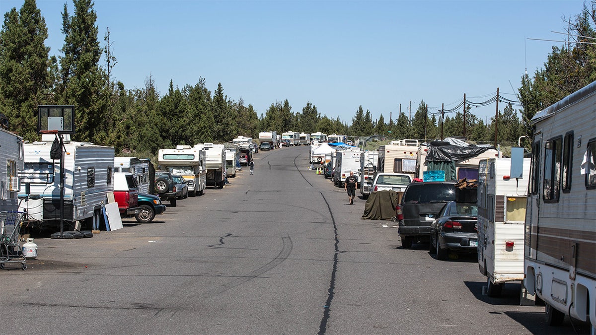 Homeless RVs and cars line a street in Bend, Oregon