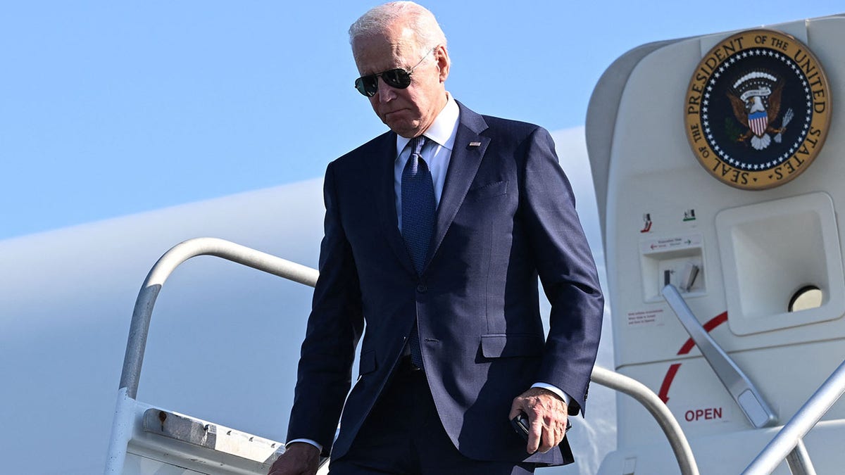 Biden walking down the stairs from Air Force One