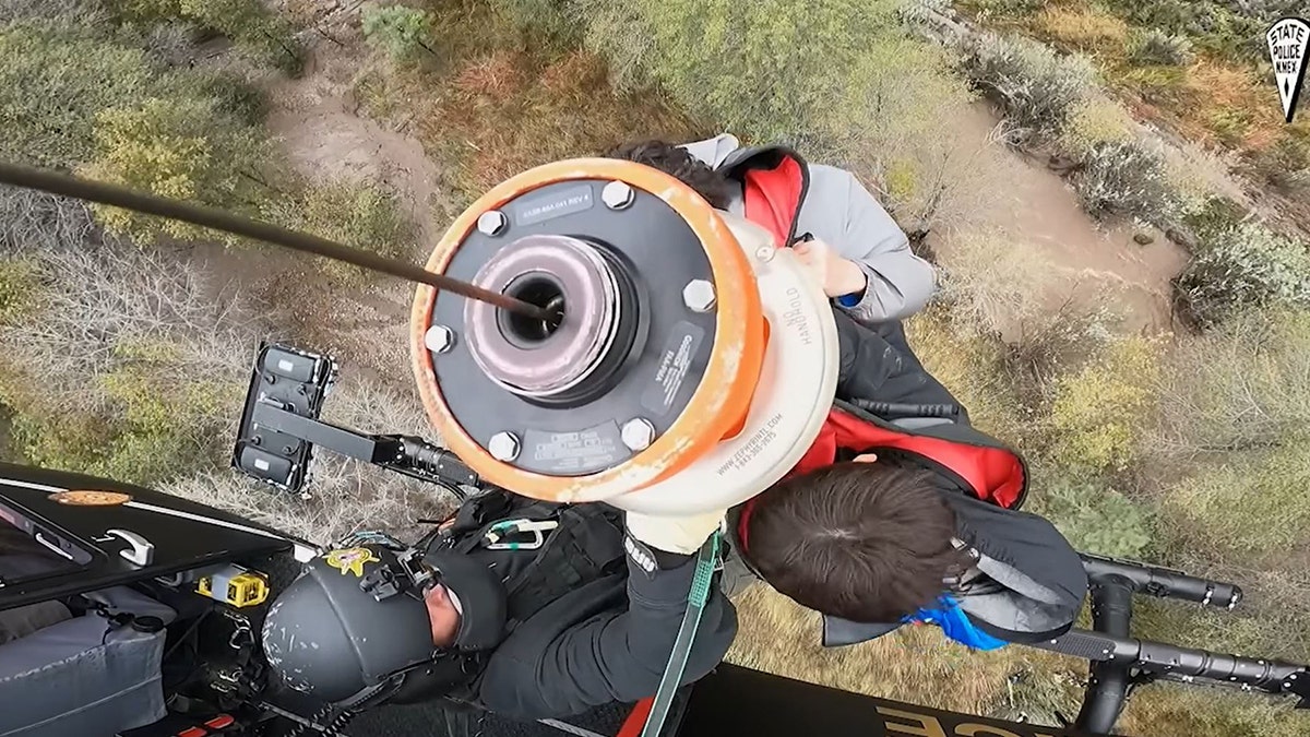 boy scouts hoisted to helicopter