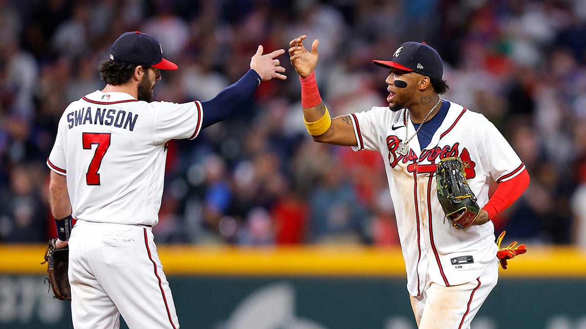 Dansby Swanson and Ronald Acuna celebrate win