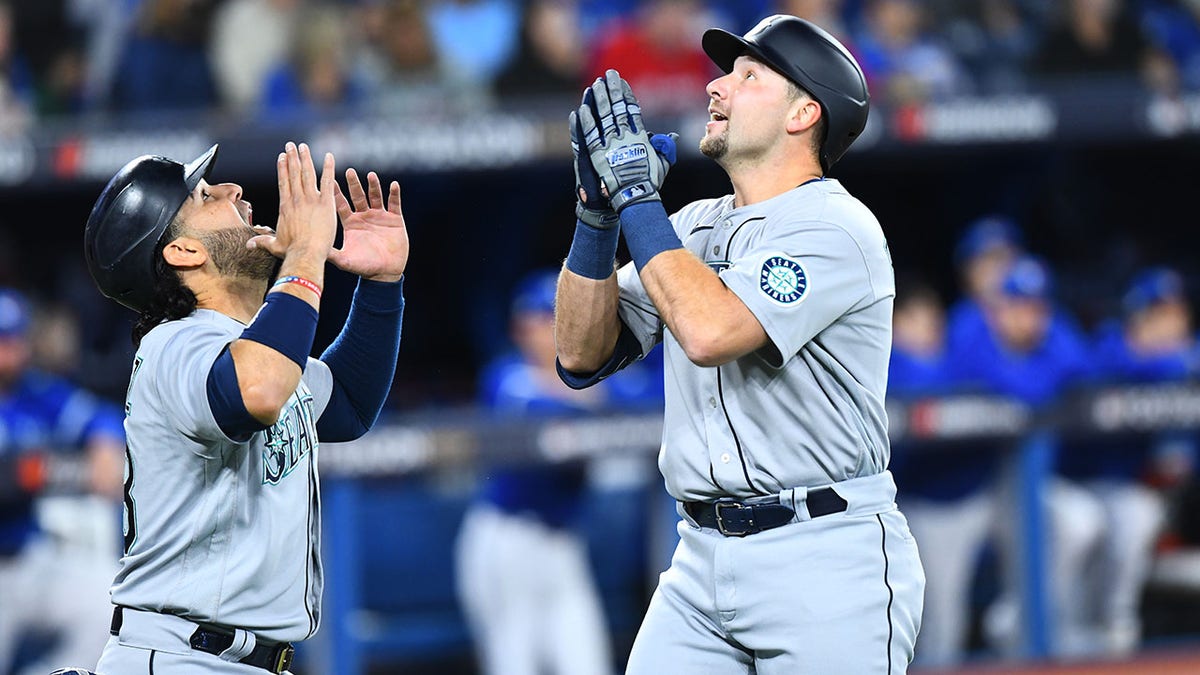 Cal Raleigh celebrates home run