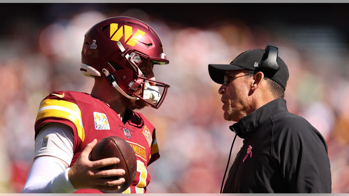 Carson Wentz talks to Ron Rivera