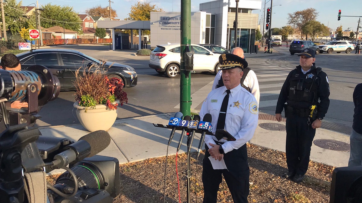 Cmdr. Don Jerome speaking to reporters