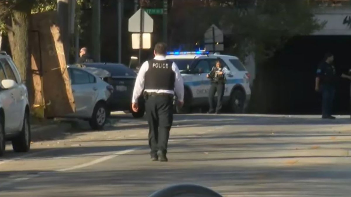 officer walking toward police car