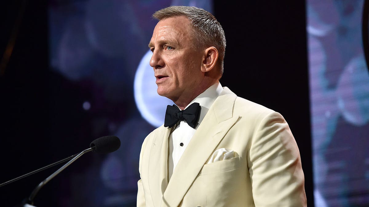 Daniel Craig speaking on stage