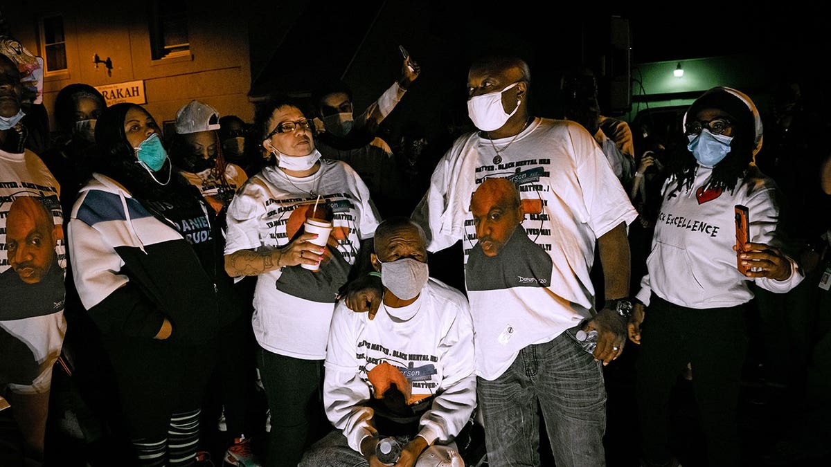 Daniel Prude's family wears matching t shirts and masks during celebration