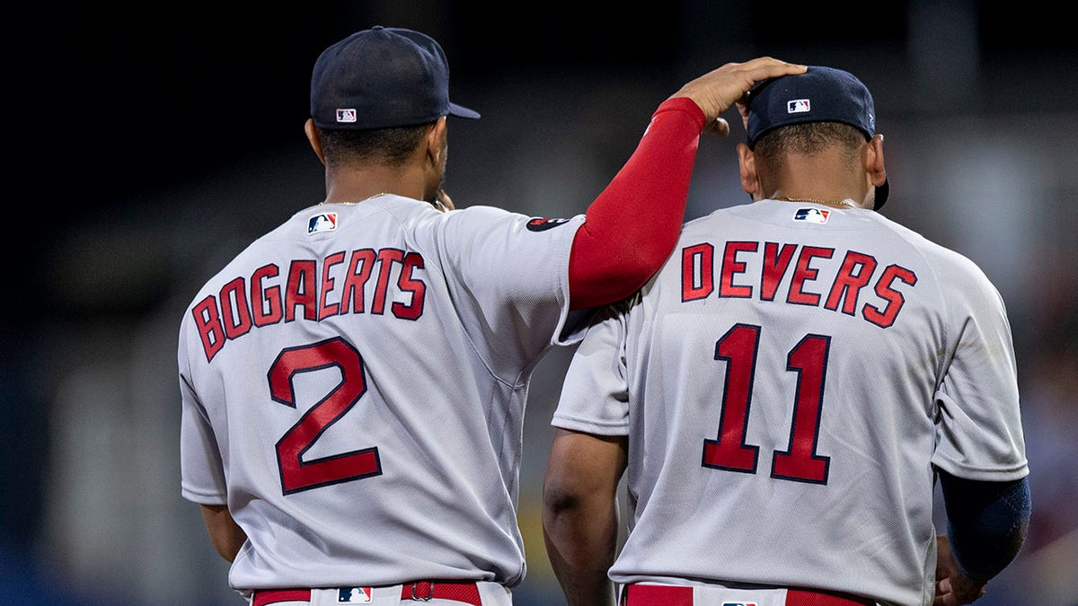 Rafael Devers and Xander Bogaerts running on field